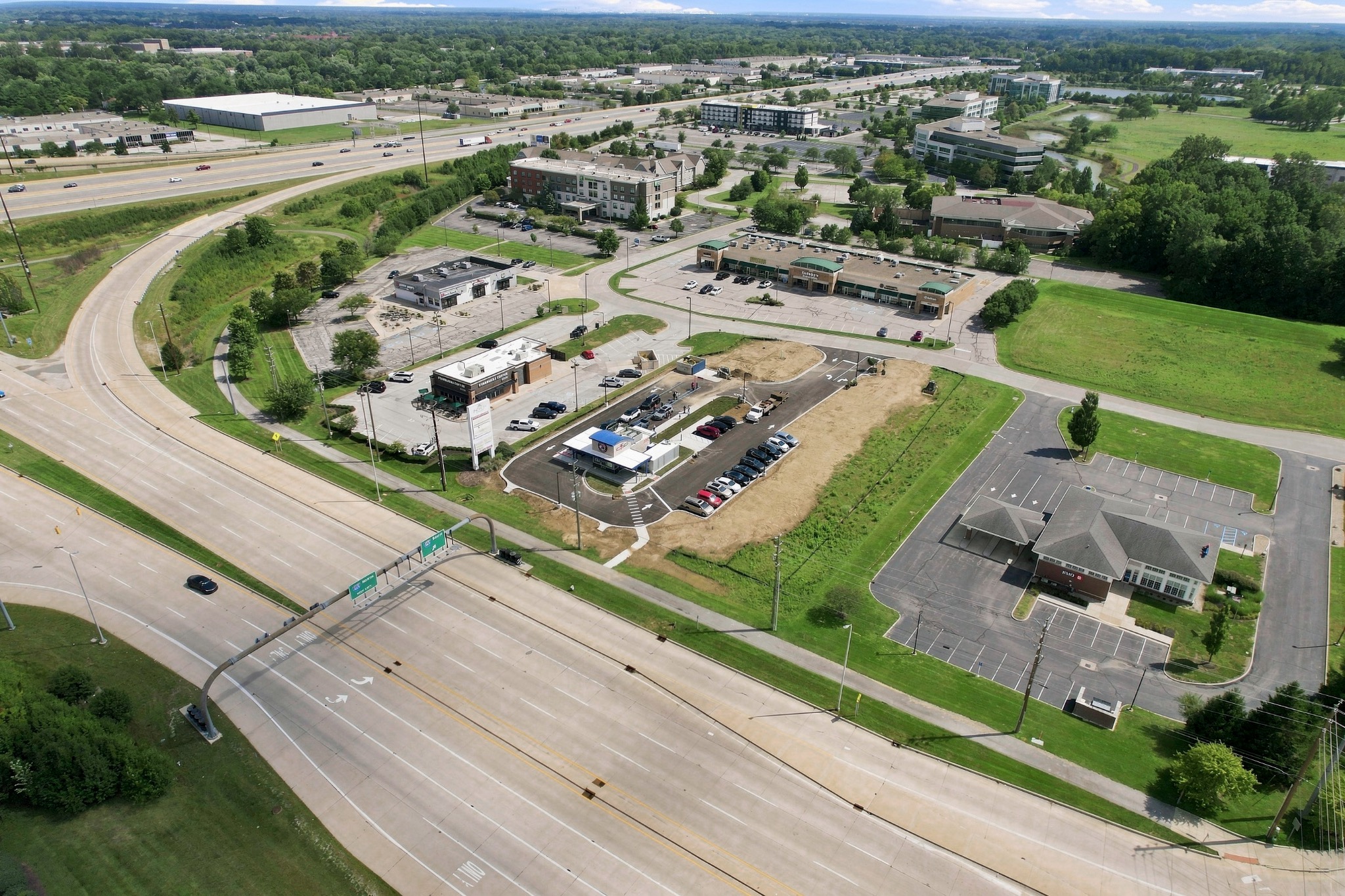 High aerial view of commercial buildings and roadway access