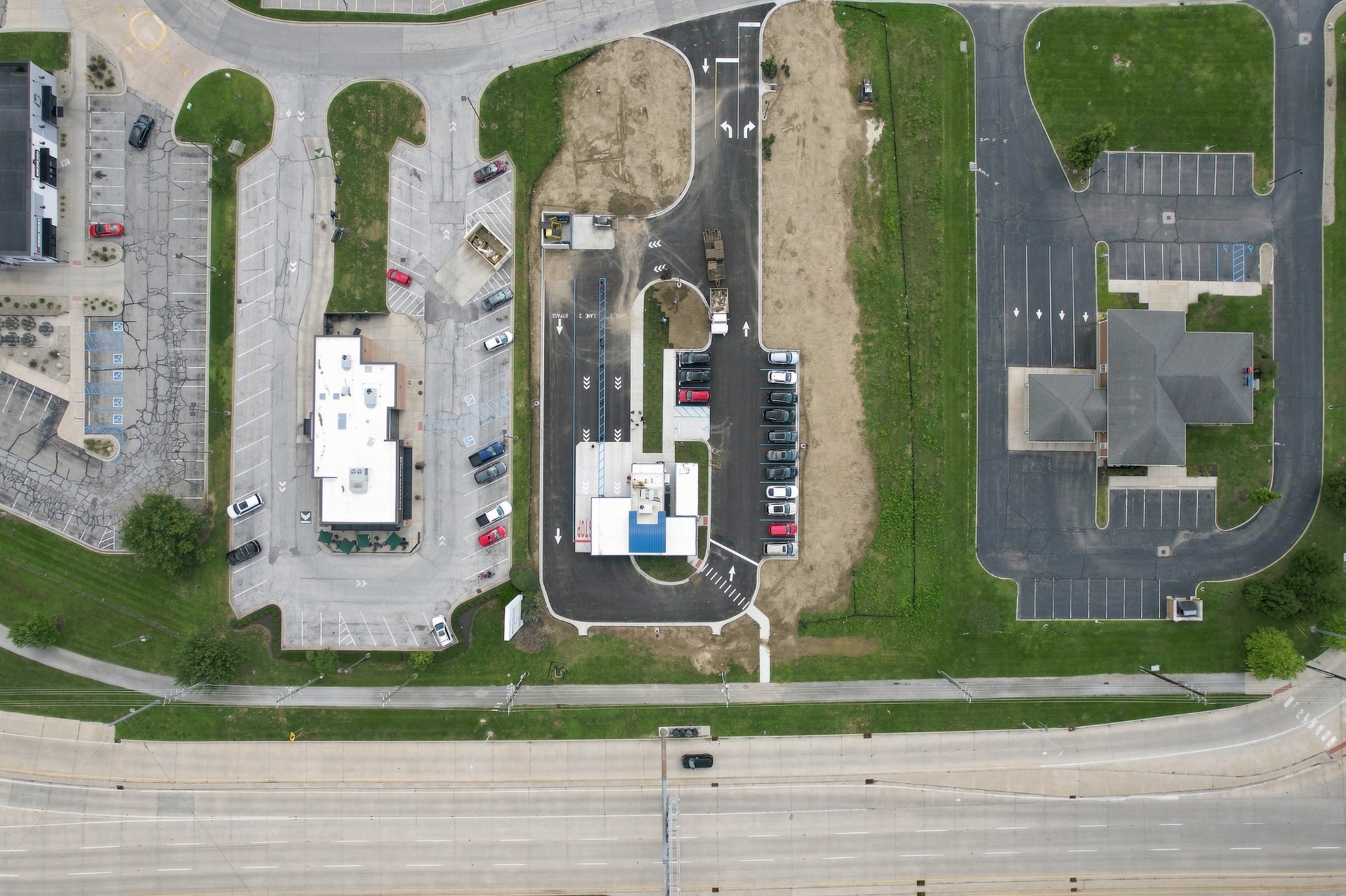 Top-down aerial view of commercial property and parking